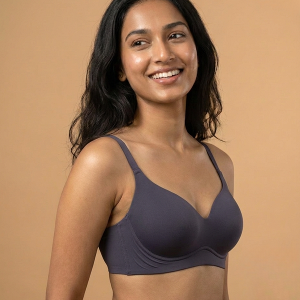 Woman wearing SHAPE Seamless T-Shirt Bra in space blue, front view