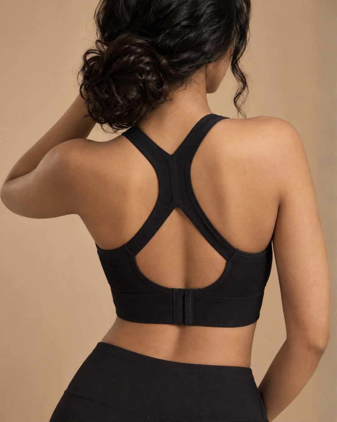 Easy Fit Sports Bra in Black, back view showing racerback straps and hook closure, SHAPE Lingerie