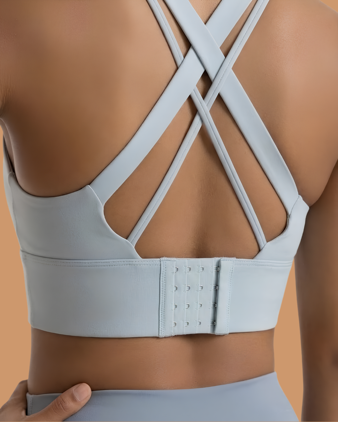 Power Sculpt Sports Bra in Sky Blue, back view showing criss-cross straps and hook closure, SHAPE Lingerie