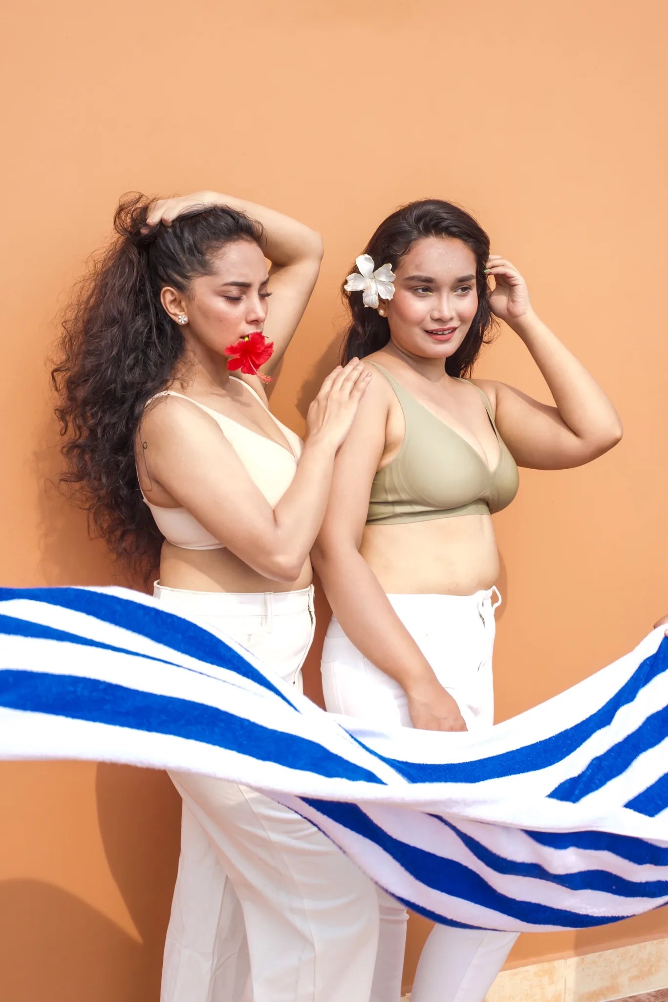 Two models wearing cream and sage SHAPE Plunge Lite bras