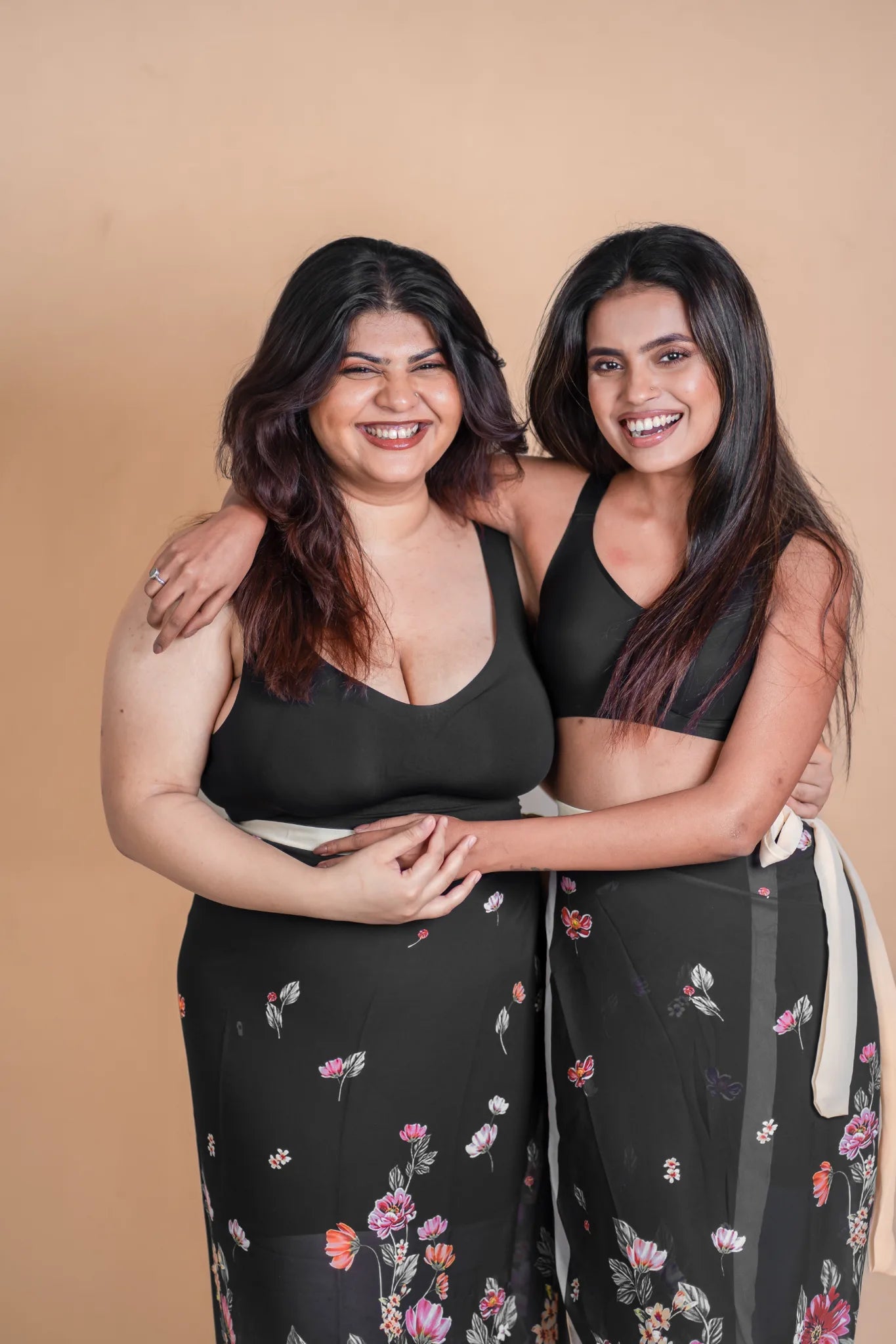 Two models wearing black SHAPE Seamless Contour Bras