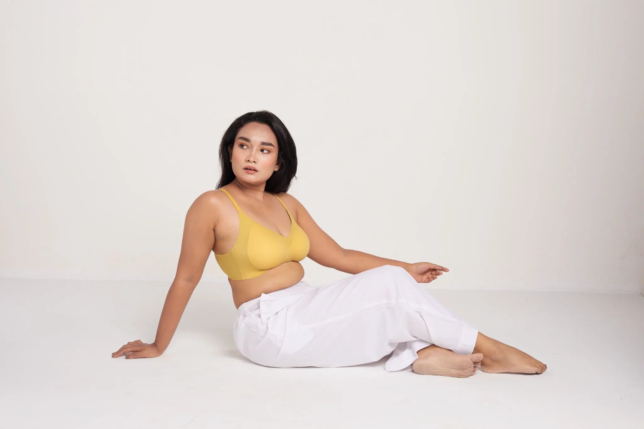 Model wearing yellow SHAPE Seamless Lite Bra